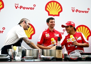 FIA Formula One World Championship 2013 - Round 13 - Grand Prix of Singapore - Felipe Massa of Brazil and Scuderia Ferrari cooks with Chef Ryan Clift during a special preview event for the Singapore Formula One Grand Prix at Marina Bay Street Circuit on September 19, 2013 in Singapore, Singapore. (Photo by Getty Images/Getty Images for Shell)